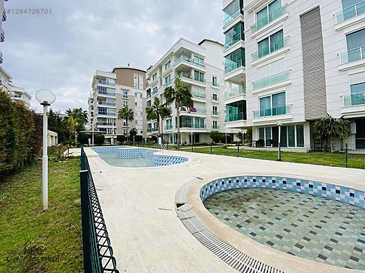 В Чаглаяне на специальном комплексе 2+1 просторный участок с садом